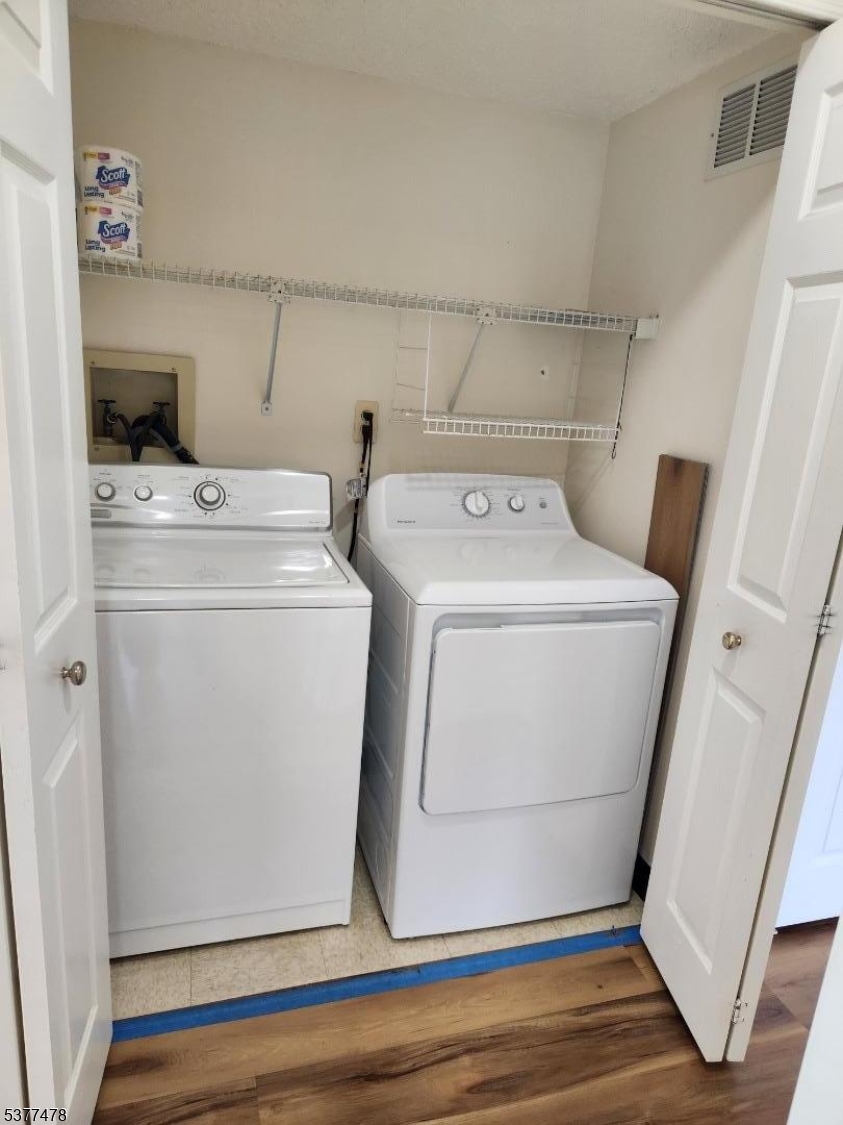 502 Dunn Circle Bridgewater, NJ 08807 - Photo 16 of 23 a utility room with dryer and washer