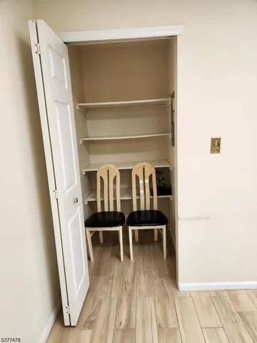 a view of a room with racks on the wall