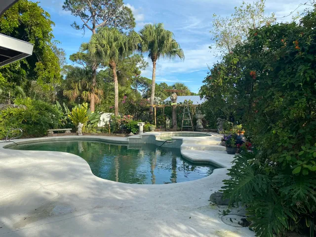 a view of swimming pool with chairs
