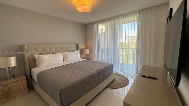 a bedroom with a bed and a table