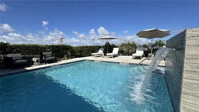 a view of a backyard with furniture