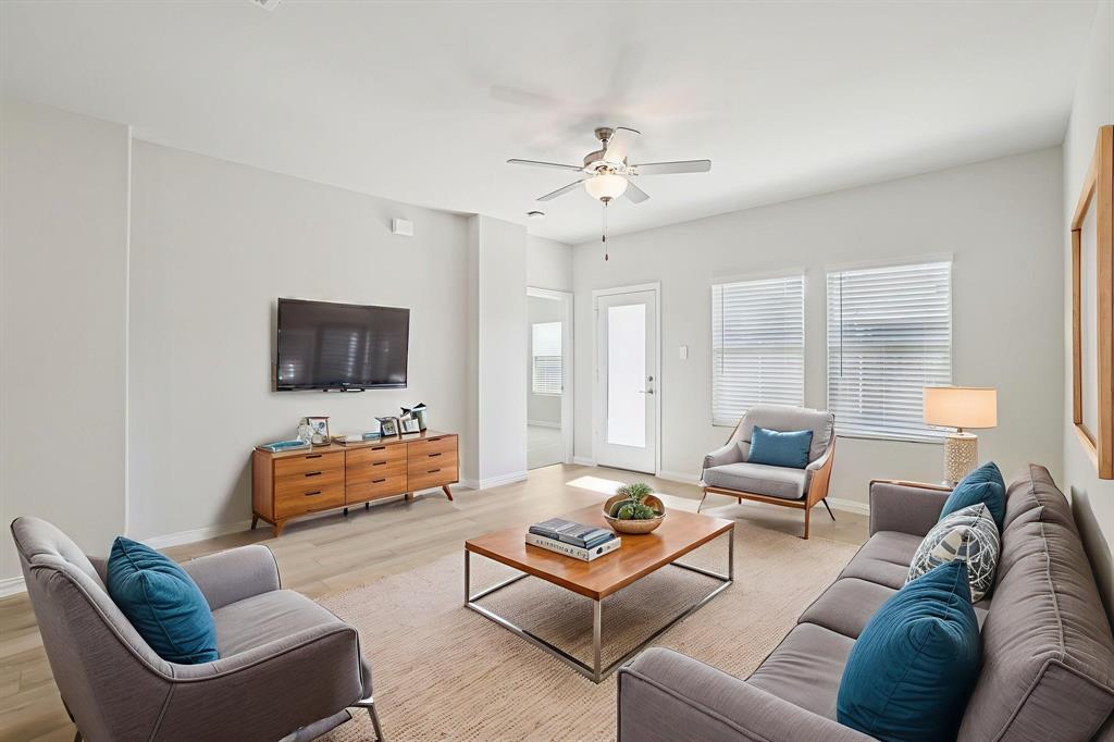 832 Sunflower Road Lavon, TX 75166 - Photo 16 of 39 a living room with furniture and a flat screen tv