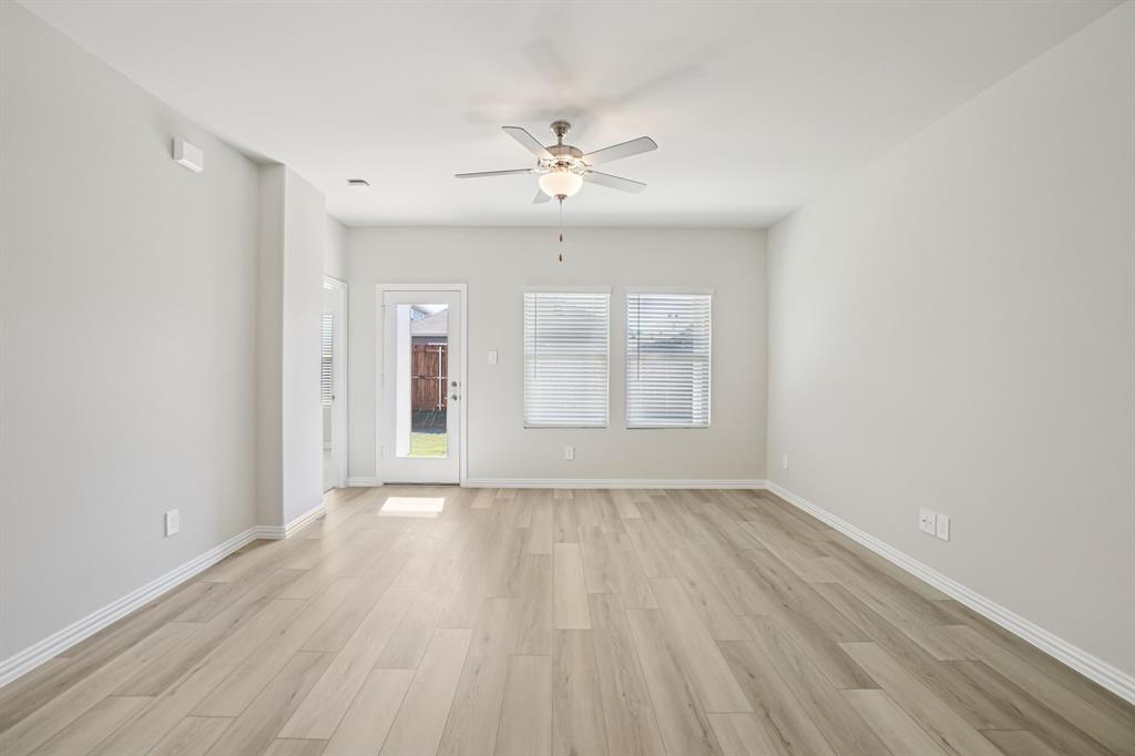 832 Sunflower Road Lavon, TX 75166 - Photo 18 of 39 wooden floor in an empty room with a window