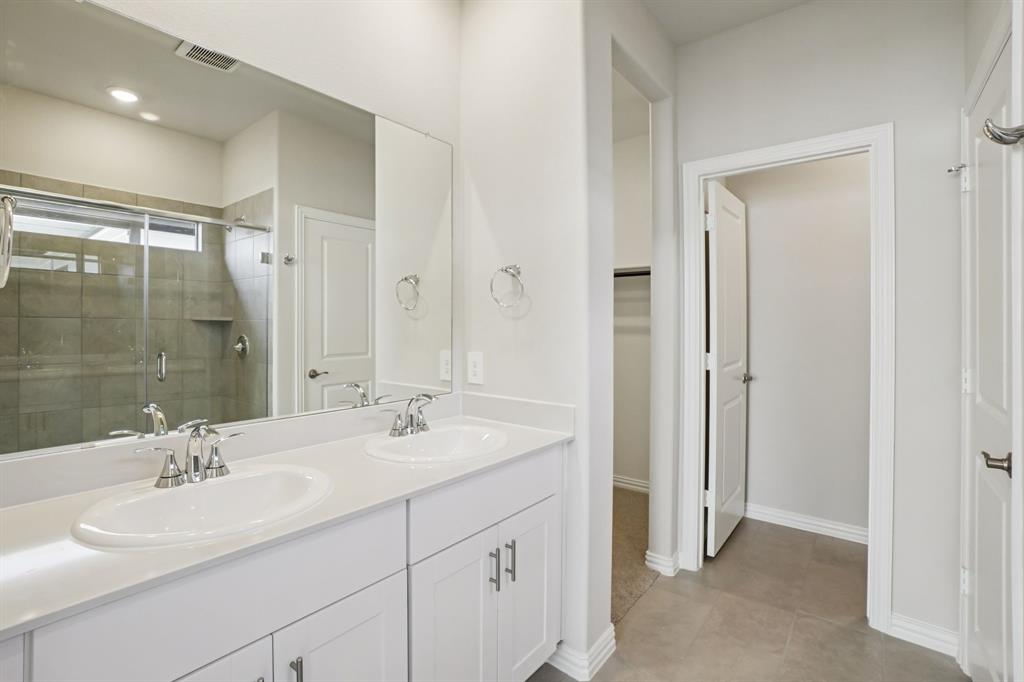 832 Sunflower Road Lavon, TX 75166 - Photo 23 of 39 a bathroom with a double vanity sink mirror and shower