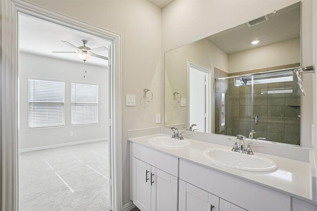 832 Sunflower Road Lavon, TX 75166 - Photo 26 of 39 a bathroom with a double vanity sink mirror and shower
