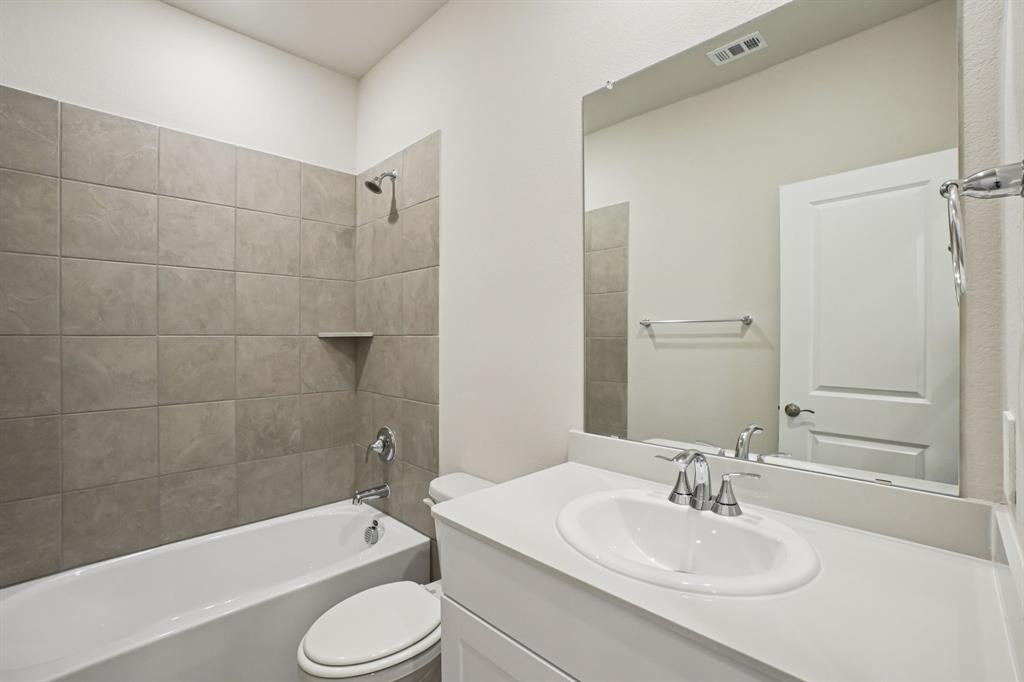 832 Sunflower Road Lavon, TX 75166 - Photo 31 of 39 a bathroom with a sink toilet tub and shower