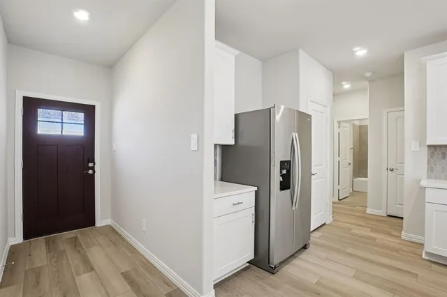 a kitchen that has a sink and a stove top oven