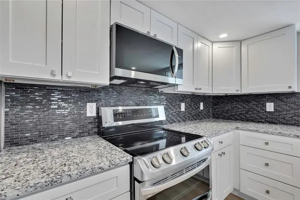 a view of a livingroom with a ceiling fan and window