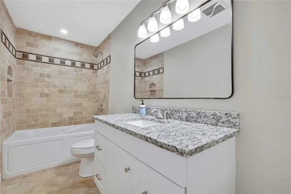 a view of a balcony with wooden floor