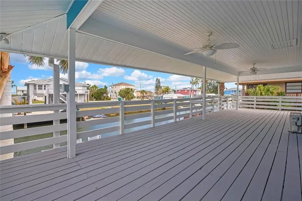 a swimming pool with outdoor seating and yard