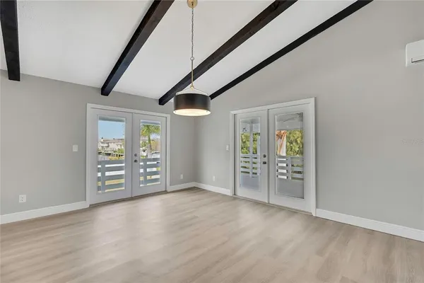 a view of a kitchen with wooden floor and a sink