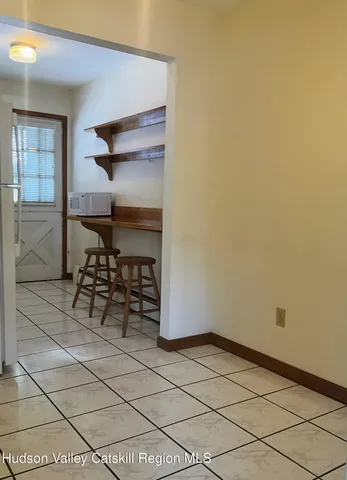 a room with a table and chairs