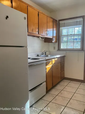 a kitchen with stainless steel appliances granite countertop a refrigerator sink and cabinets