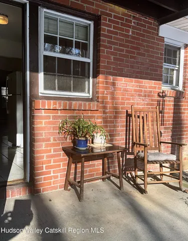 a view of a balcony with chairs