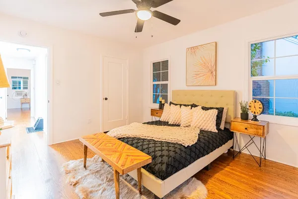 a bedroom with a bed and window