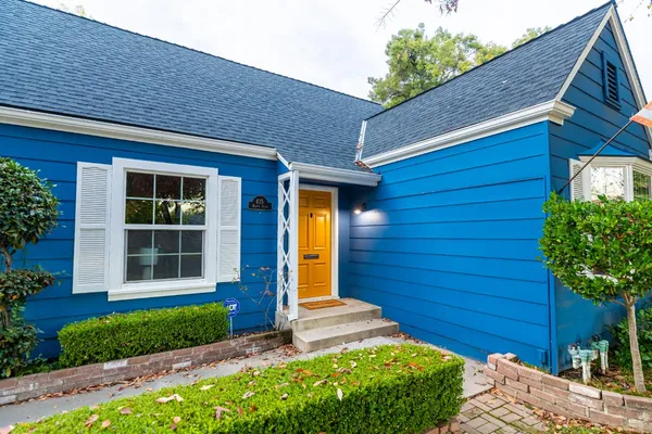 a front view of a house with a yard