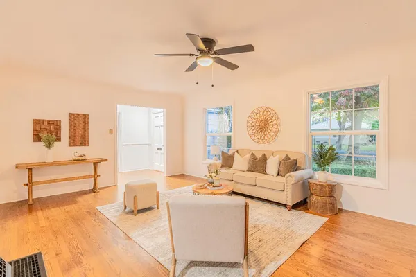 a living room with furniture and a large window