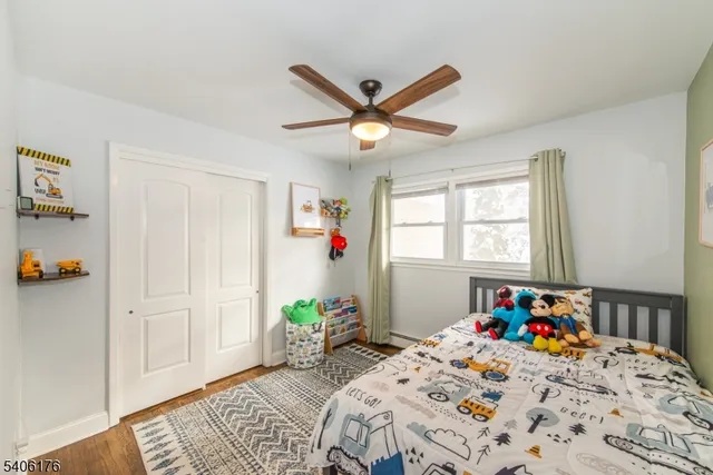 a bedroom that has a bed and a chandelier