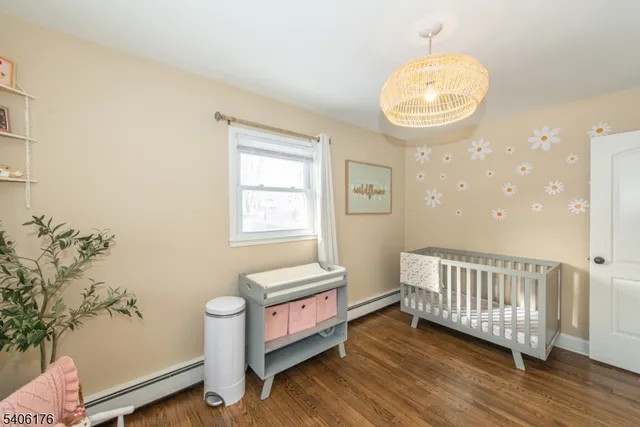 a view of a room with wooden floor and windows