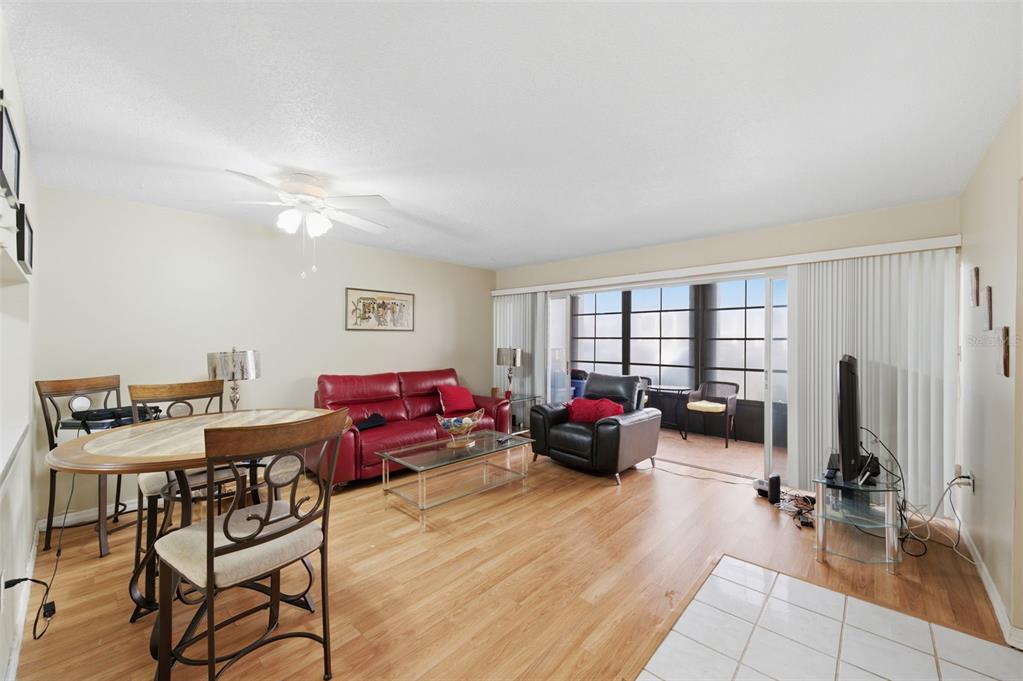 7701 Starkey Road, Unit 237 Seminole, FL 33777 - Photo 6 of 32 a living room with furniture and a flat screen tv