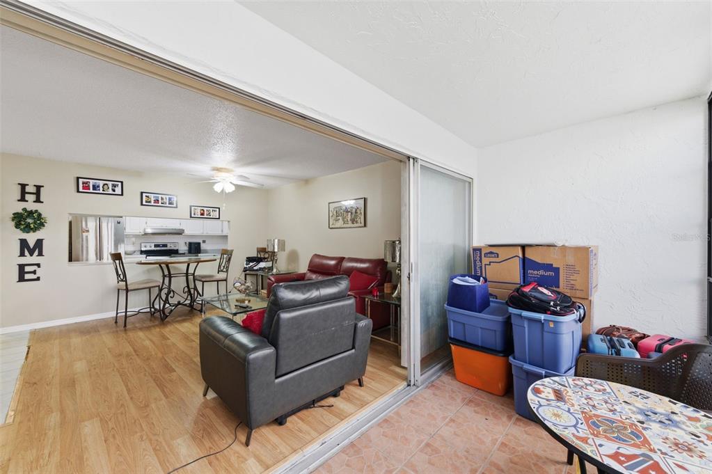 7701 Starkey Road, Unit 237 Seminole, FL 33777 - Photo 10 of 32 a living room with furniture and wooden floor