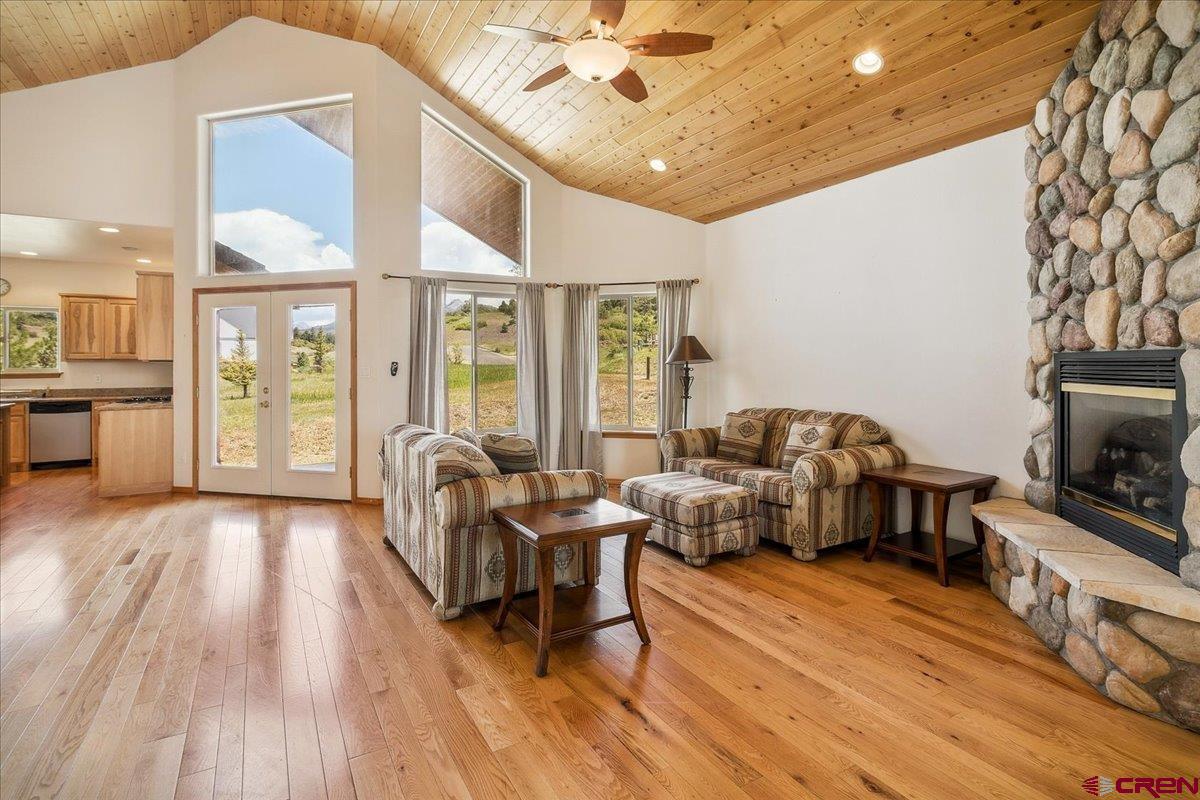 196 Dylan Drive Pagosa Springs, CO 81147 - Photo 12 of 44 a living room with furniture and a fireplace