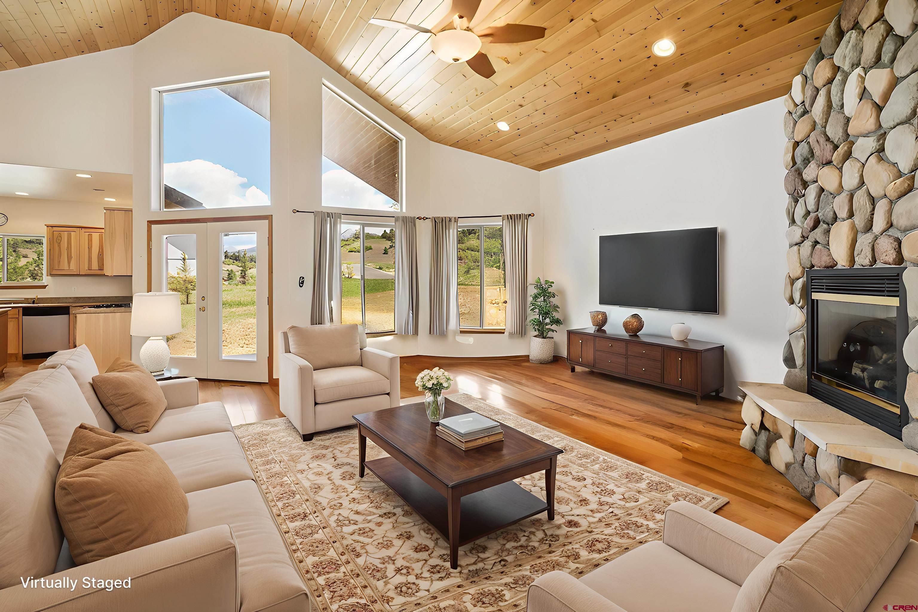 196 Dylan Drive Pagosa Springs, CO 81147 - Photo 17 of 44 a living room with furniture and a flat screen tv