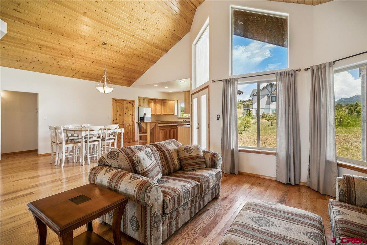 196 Dylan Drive Pagosa Springs, CO 81147 - Photo 18 of 44 a living room with furniture a bed and a table