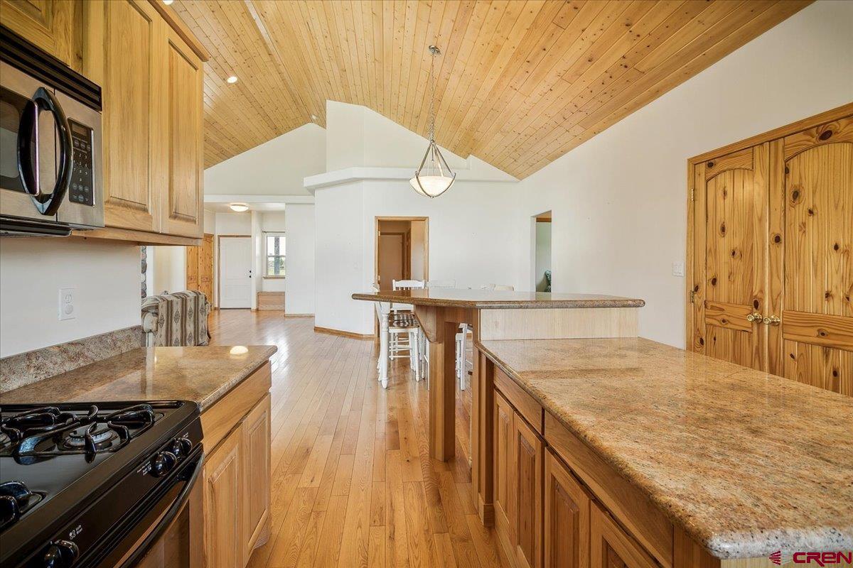 196 Dylan Drive Pagosa Springs, CO 81147 - Photo 26 of 44 a kitchen with stainless steel appliances granite countertop a stove and a sink