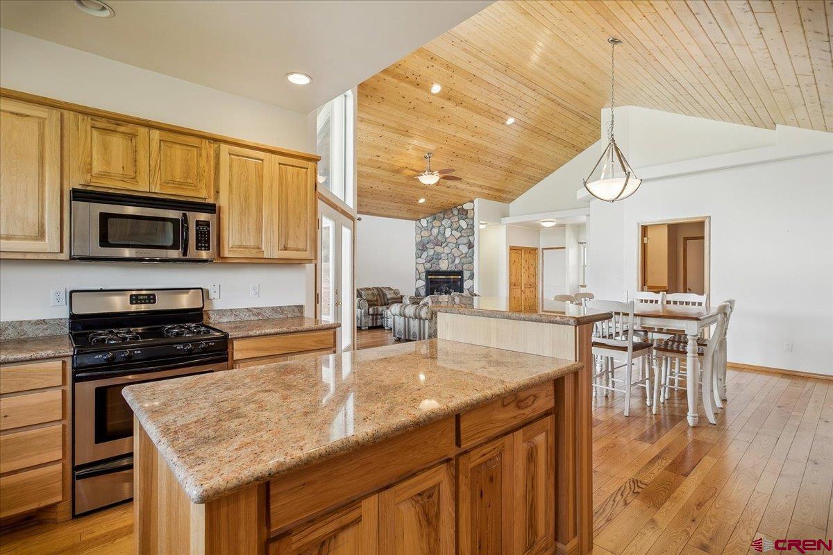 196 Dylan Drive Pagosa Springs, CO 81147 - Photo 28 of 44 a kitchen with a stove a sink and a microwave