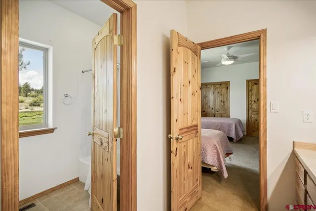 a view of a bedroom from a hallway
