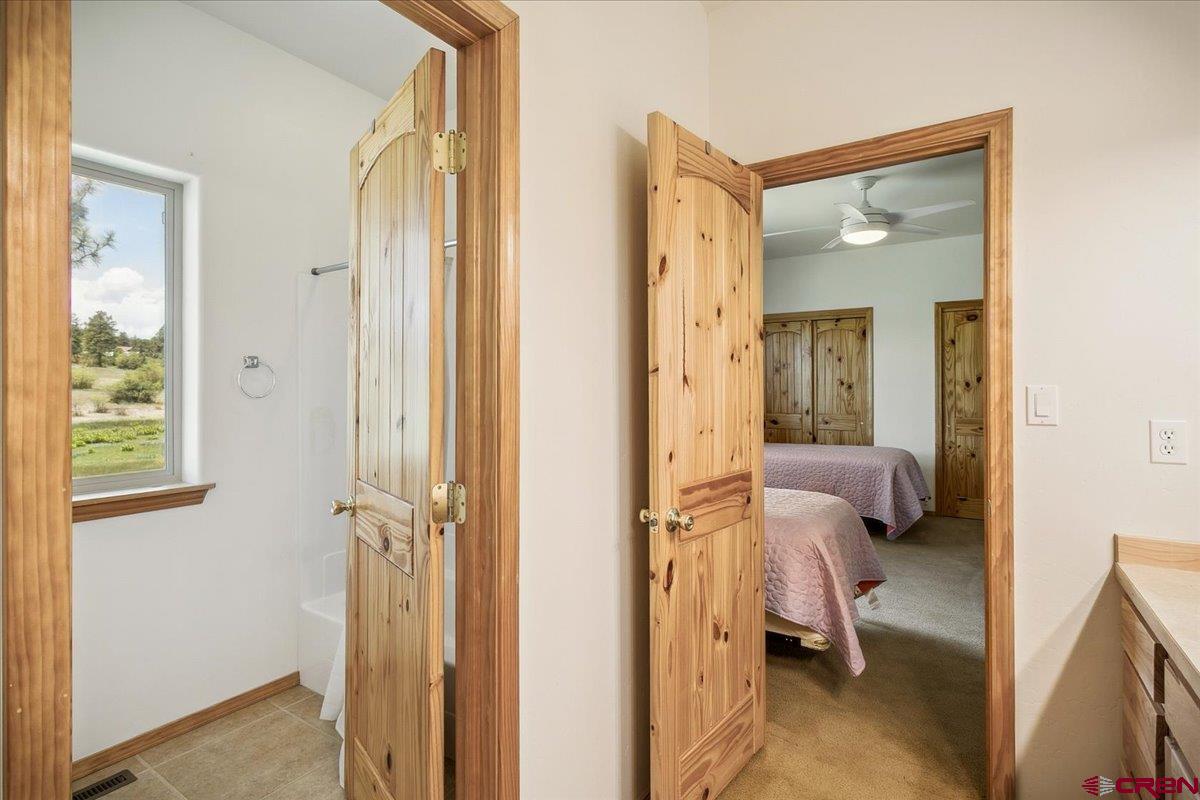 196 Dylan Drive Pagosa Springs, CO 81147 - Photo 32 of 44 a view of a bedroom from a hallway
