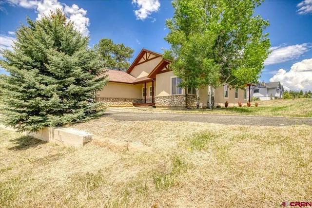a house with trees in front of it