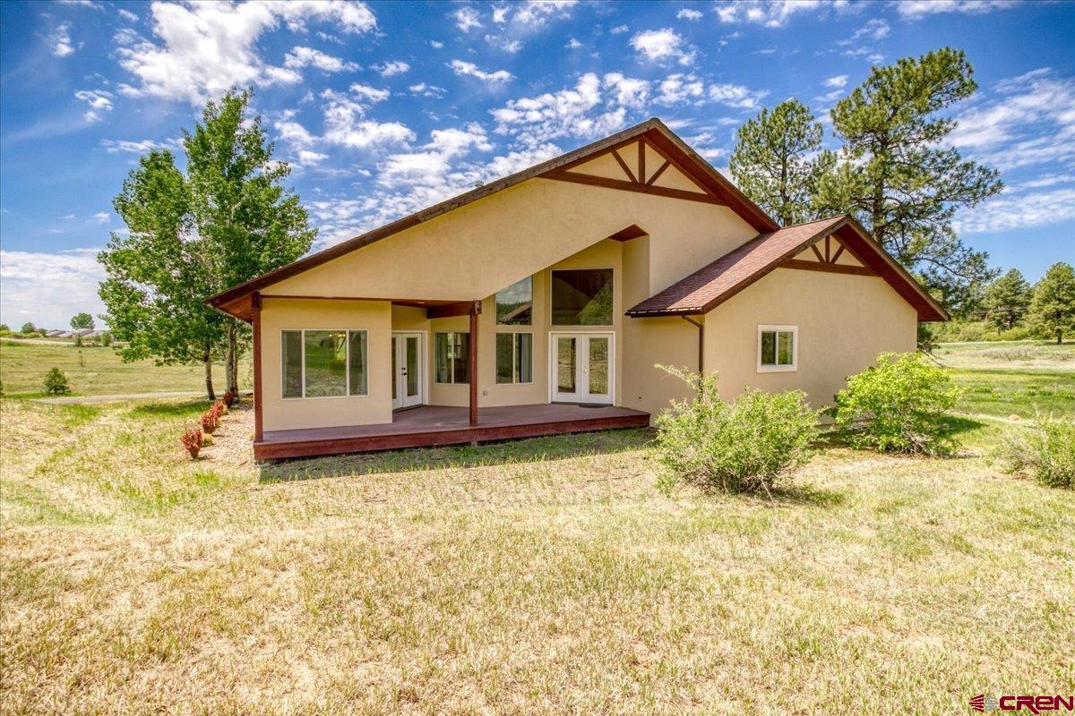 196 Dylan Drive Pagosa Springs, CO 81147 - Photo 6 of 44 a view of a house with a yard
