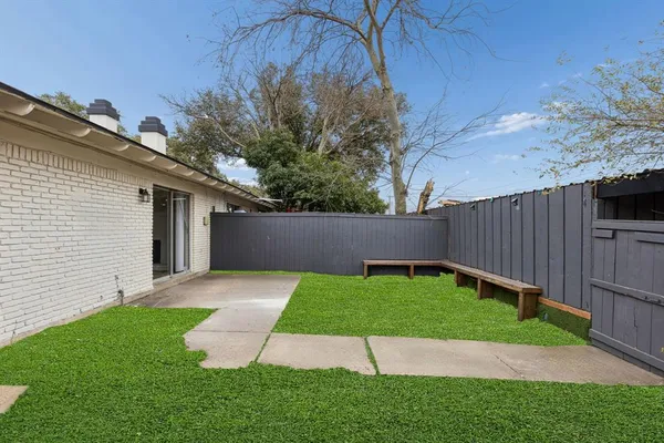 a view of a backyard with a small cabin