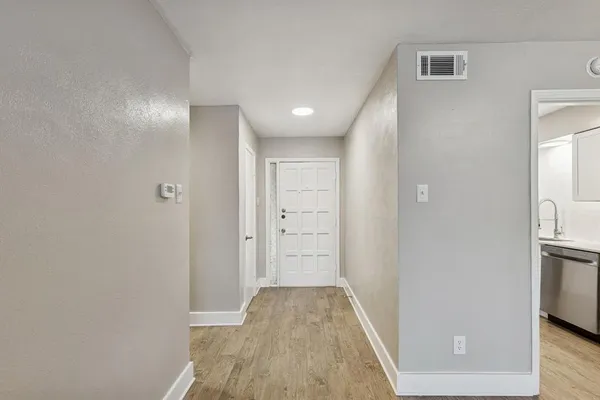 a view of hallway with livingroom