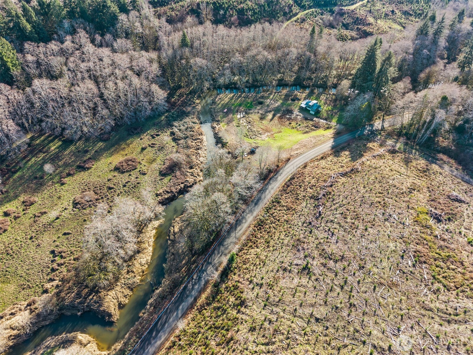 138 Ward Creek Road Raymond, WA 98577 - Photo 16 of 21 a view of a yard with wooden fence