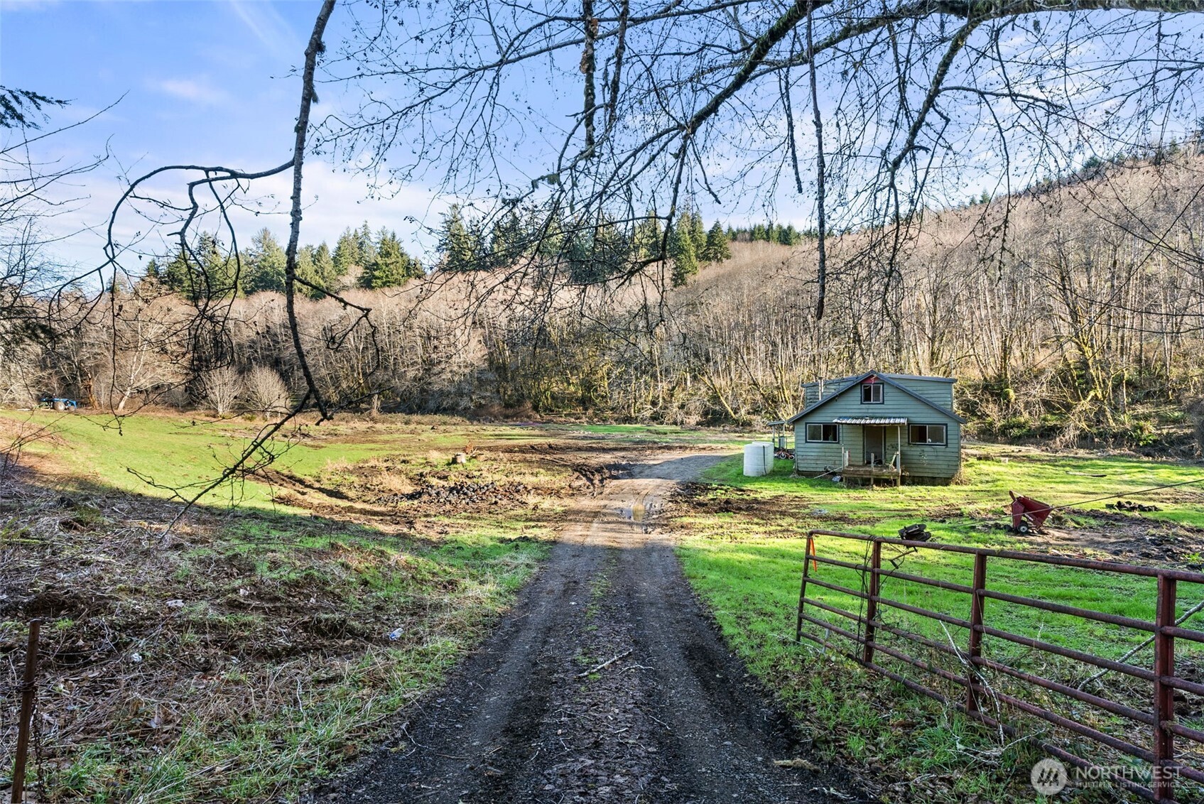 138 Ward Creek Road Raymond, WA 98577 - Photo 18 of 21 a view of a garden with a bench