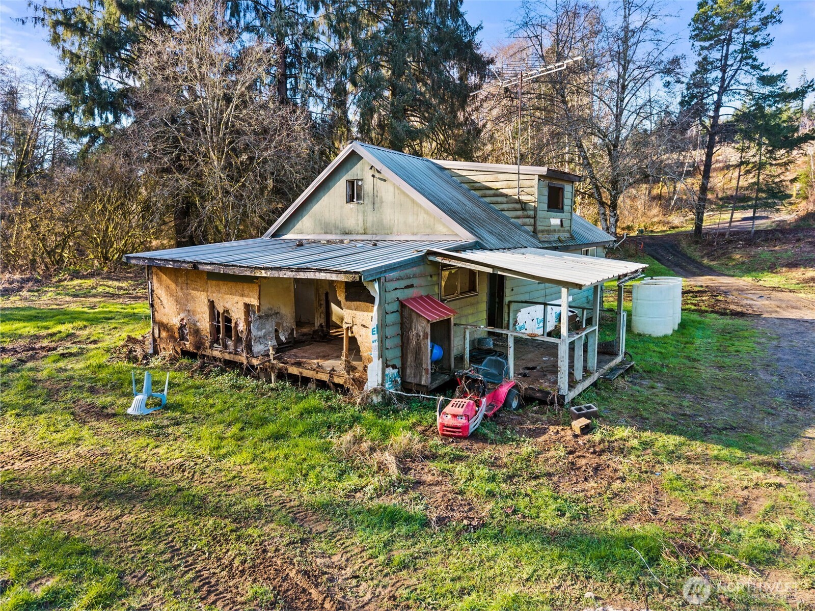 138 Ward Creek Road Raymond, WA 98577 - Photo 6 of 21 a view of a chair and table in the garden
