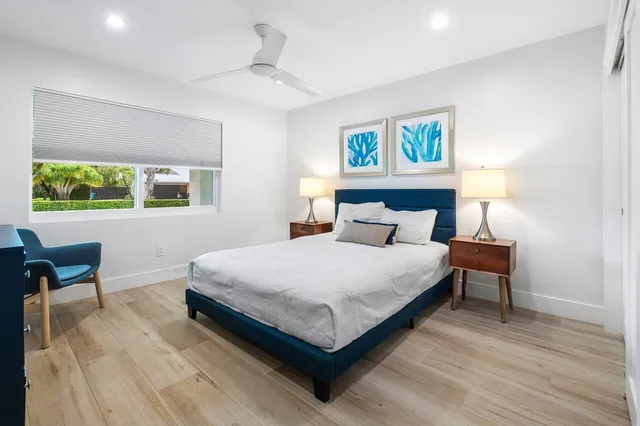 a bedroom with a bed and window