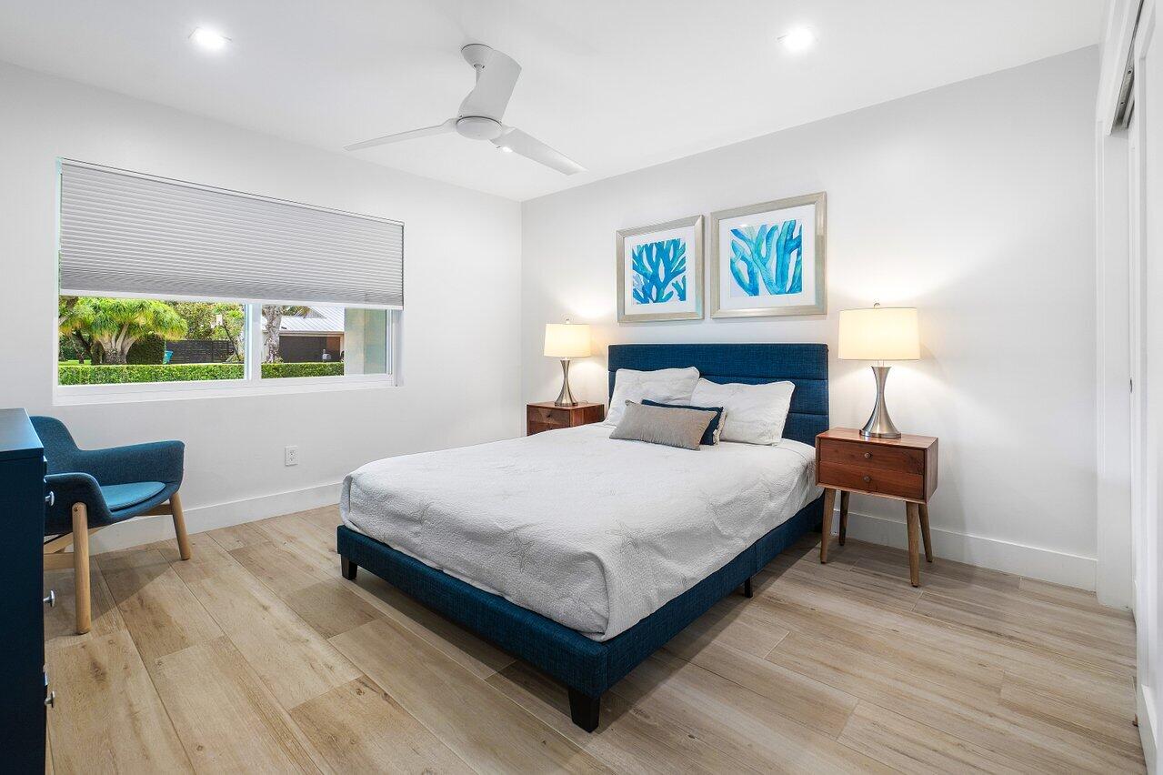 936 Southwest 38th Court Boynton Beach, FL 33435 - Photo 13 of 18 a bedroom with a bed and window