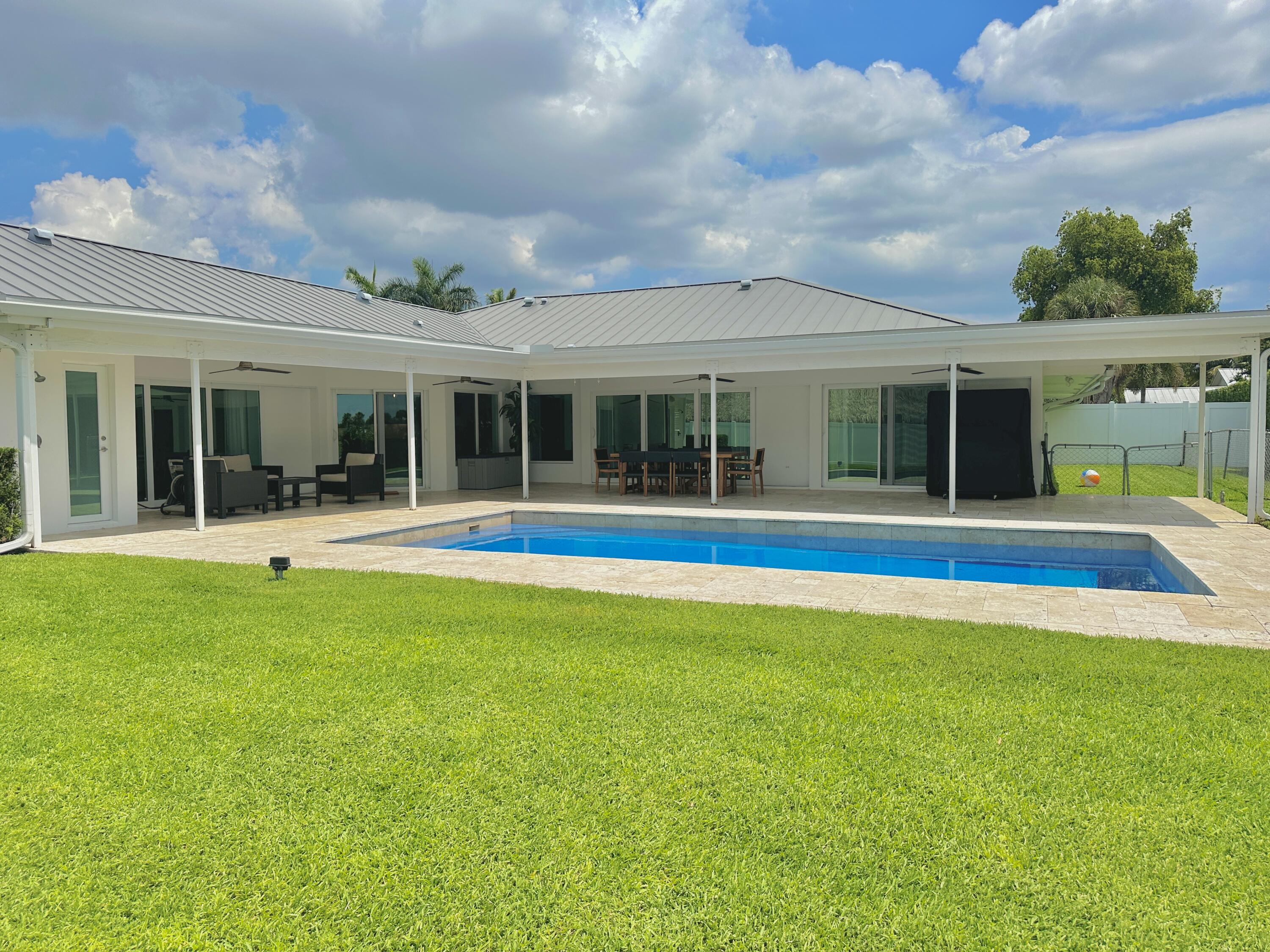 936 Southwest 38th Court Boynton Beach, FL 33435 - Photo 16 of 18 a view of pool with an outdoor seating