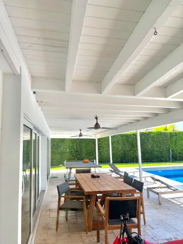 a table and chairs with the wooden floor