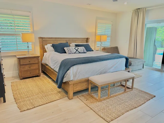 a bedroom with a bed and window