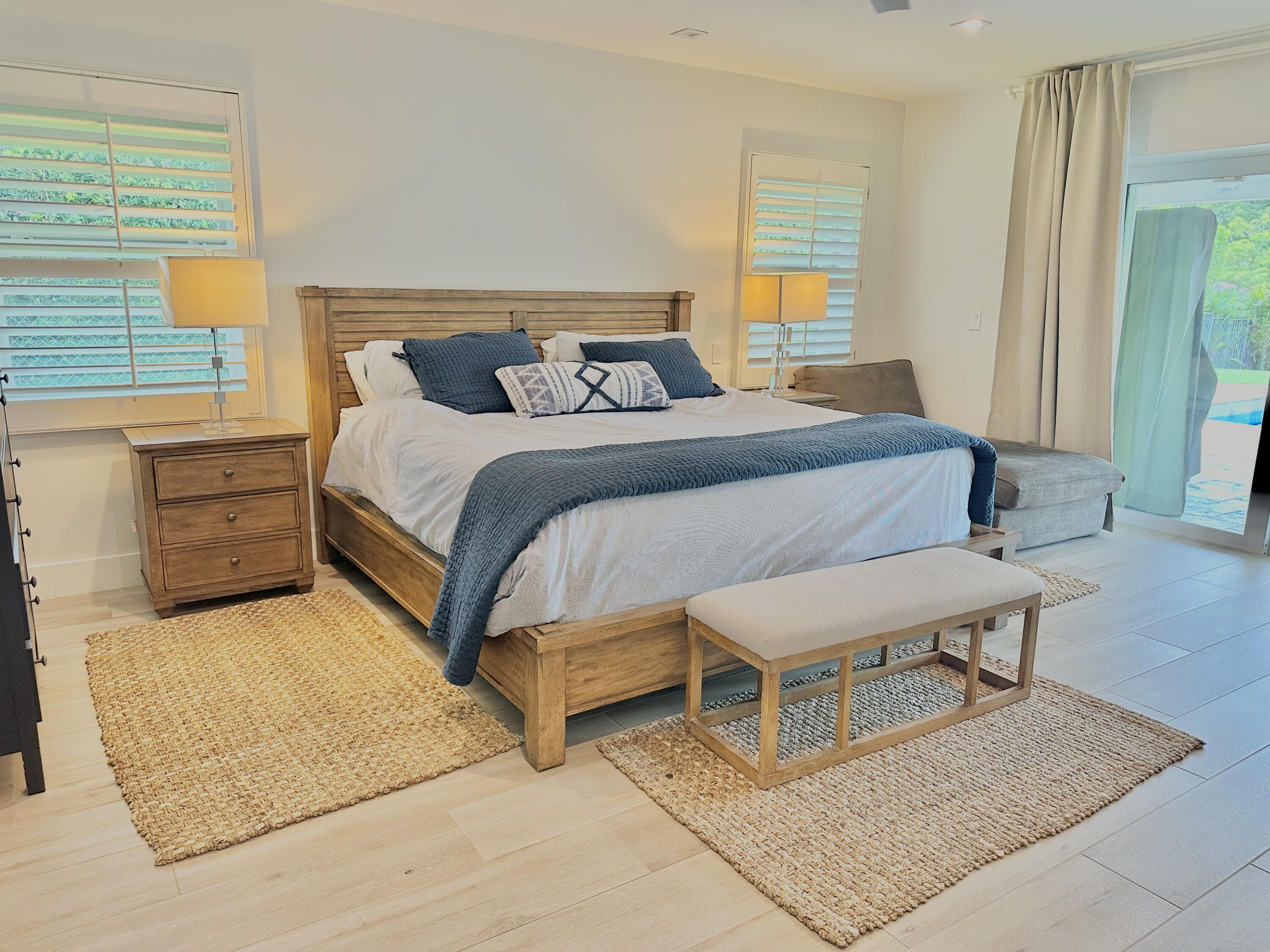 936 Southwest 38th Court Boynton Beach, FL 33435 - Photo 9 of 18 a bedroom with a bed and window