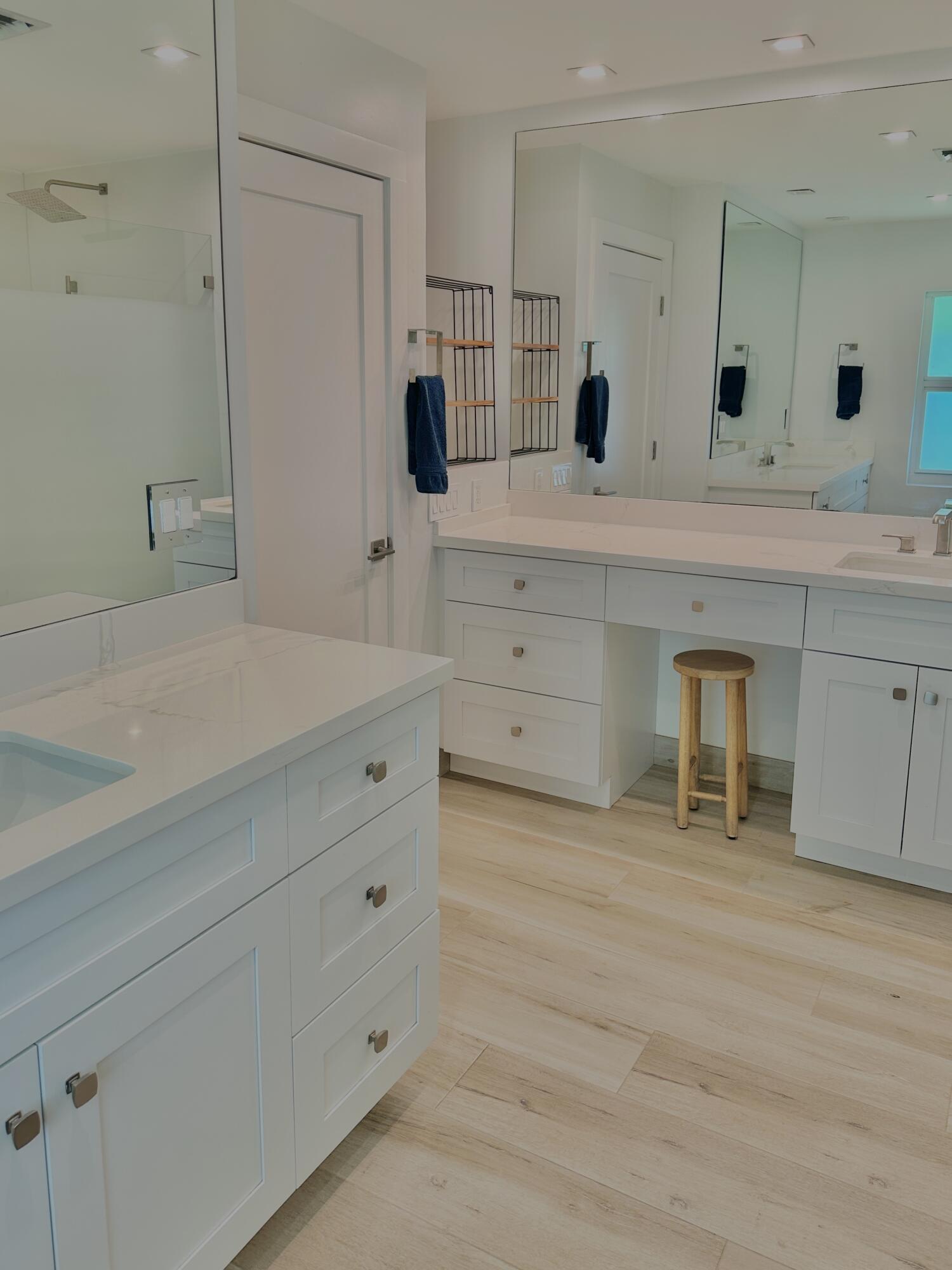 936 Southwest 38th Court Boynton Beach, FL 33435 - Photo 10 of 18 a spacious bathroom with a double vanity sink mirror and bathtub
