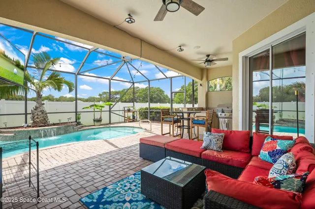 a roof deck with couch and city view