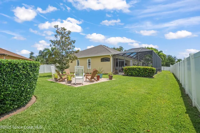 a front view of a house with table and chairs