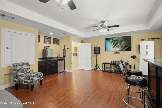 a living room with furniture fireplace and flat screen tv