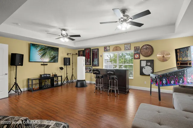 a view of a livingroom with furniture window and wooden floor